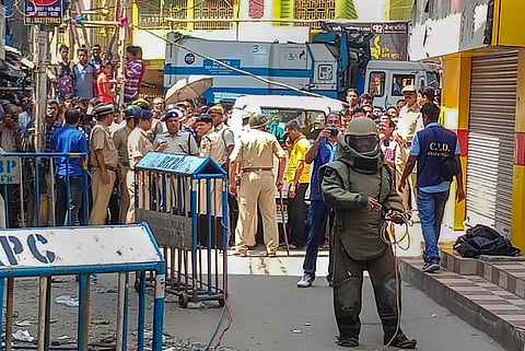 Bomb disposal squad personnel inspect a low-intensity explosion in front of a multi-storey building in Nagerbazar area at Kazipara in Kolkata Tuesday Oct 2 2018. (File| PTI)