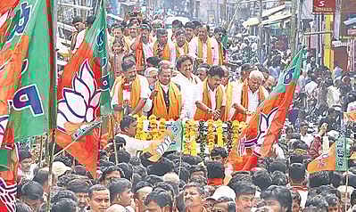 Supporters throng the procession of B Y Raghavendra in Shivamogga city after he filed his nomination papers. | (Shimoga Nandan | EPS)