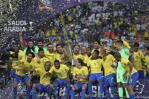 Brazil's Neymar holds the trophy as he celebrates with his teammates after the friendly soccer match between Brazil and Argentina at King Abdullah stadium in Jeddah, Saudi Arabia. (AP)