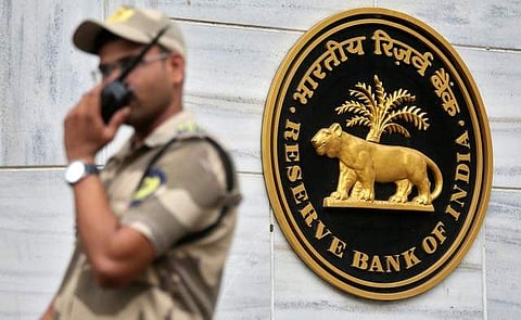 A guard stands next to the Reserve Bank of India (RBI) logo outside its headquarters in Mumbai, India, October 5, 2018. (Photo: Reuters)