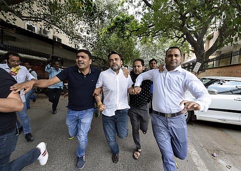 Ashish Pandey accused of brandishing gun at guests outside a hotel being brought out of the Patiala House Courts in New Delhi Thursday October 18 2018.| PTI