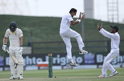 Pakistan's Mohammad Abbas celebrates the dismissal of Australia's Travis Head in their test match in Abu Dhabi, United Arab Emirates. ( Photo | AP)