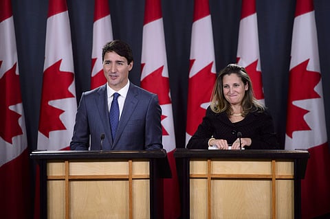 Canadian Prime Minister Justin Trudeau, left, and Minister of Foreign Affairs Chrystia Freeland hold a news conference regarding the United States Mexico Canada Agreement (USMCA) at the National Press Theatre, in Ottawa, Ontario on Monday, Oct. 1, 2018. (