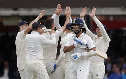 India's Murali Vijay leaves the pitch after he is bowled by England's James Anderson during the second day of the second test match between England and India at Lord's cricket ground in London. (Photo | AP)