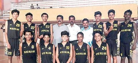 Jose Sebastian with the school team