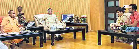 Uttar Pradesh Chief Minister Yogi Adityanath and his deputy Dinesh Sharma with slain Apple executive Vivek Tiwari’s wife Kalpana, in Lucknow on Monday | PTI