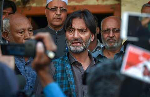 JKLF Chairman Mohammad Yasin Malik talks to the media before his arrest by the police ahead of Panchayat and Local bodies elections in Srinagar. (Photo| PTI)