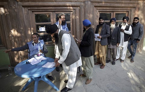 Voters from the minority Sikh register to cast in Parliamentary elections in old city of Kabul, Afghanistan, Saturday. ( Photo | AP)