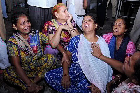 Relatives of victims of the train accident mourn at civil Hospital at Joda Phatak in Amritsar. (PTI)