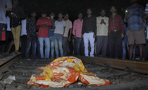 People gather near the body of a victim at the site of a train accident at Joda Phatak in Amritsar. (Photo| PTI)
