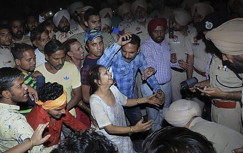 Relatives mourn at the site of a train accident at Joda Phatak in Amritsar (Photo | PTI)