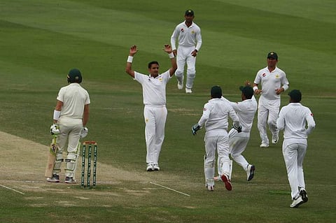 Pakistan cricketer Mohammad Abbas (2R) celebrates after dismissing Australian cricketer Marnus Labuschagne during day four of the second Test cricket match between Australia and Pakistan at Sheikh Zayed stadium in Abu Dhabi on October 19, 2018. (Photo | A