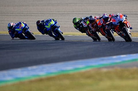 (From L) Team Suzuki Ecstar Spanish rider Alex Rins, Team Suzuki Ecstar Italian rider Andrea Iannone, LCR Honda British rider Cal Crutchlow, Repsol Honda Team Spanish rider Marc Marquez and Ducati Team Italian rider Andrea Dovizioso compete during the Mot