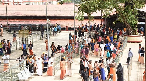 Amid speculations of entry of women in the 10-50 age group to the Sabarimala shrine, devotees opposing their entry anxiously waiting in front of the holy steps. | (BP Deepu | EPS)