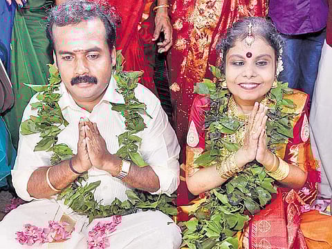 Vaikom Vijayalakshmi with her husband Anoop after tying the knot at Vaikom on Monday
