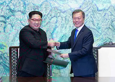 Kim Jong Un and Moon Jae-in (Photo | AP)