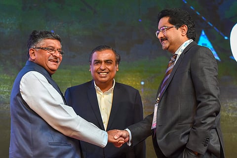 Union Law and Justice Minister Ravi Shankar Prasad L shakes hands with Aditya Birla Group Chairman Kumar Mangalam Birla as Reliance Industries Ltd. Chairman Mukesh Ambani looks on during the Indian Mobile Congress 2018 at Aerocity in New Delhi. (Photo | P