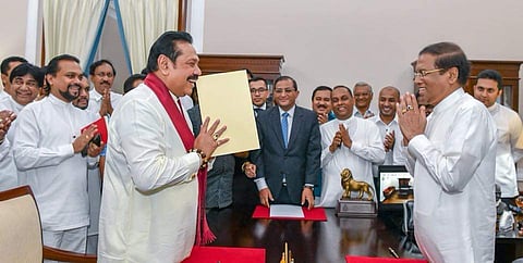 (L-R) Mahinda Rajapaksa greets President Maithripala Sirisena after being sworn in as the new Prime Minister of Sri Lanka in a dramatic political development on 2 October 2018 after his party abruptly quit the ruling coalition. (Photo | Twitter)