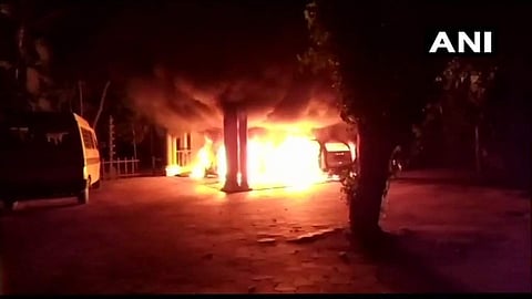 Two cars and a two-wheeler belonging to the ashram set ablaze. (Photo|ANI)