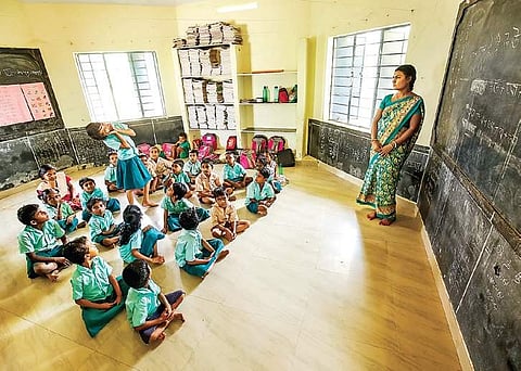 S Poyishaki, a teacher from West Bengal, taking classes for children of migrant labourers in their native language | Express