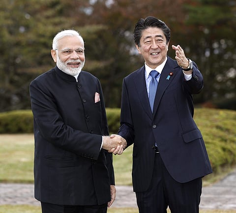 India's Prime Minister Narendra Modi, left, shakes hands with Japan's Prime Minister Shinzo Abe in Yamanakako village. (Photo | AP)