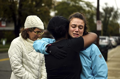 Survivors and kin of victims cry after a deadly shootout near a Jewish synagogue in Pittsburgh (Photo | AP)