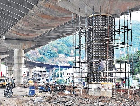 VMC developing vertical organic gardens on Kanaka Durga flyover pillars in city | R V K Rao