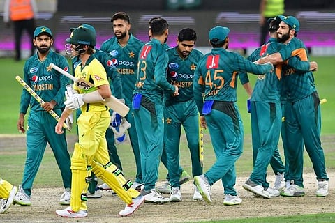 Pakistan's cricketers celebrate at the end of the third T20 match between Pakistan and Australia at The International Cricket Stadium in Dubai on October 28, 2018. | AFP