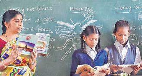 Radha Kumari KS teaching English to students of BBMP Higher Primary School near Shivajinagar | EXPRESS