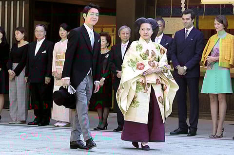 Japanese princess Ayako and groom Kei Moriya arrive at Meiji shrine for their wedding ceremony in Tokyo, Monday. (Photo | AP)