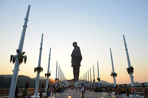 Indian policemen stand guard near the 'Statue Of Unity', the world's tallest statue dedicated to Indian independence leader Sardar Vallabhbhai Patel, near Sardar Sarovar Dam near Vadodara in India's western Gujarat state on October 30, 2018. | AFP