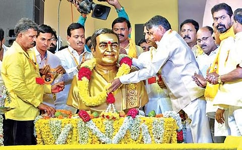 Chief Minister N Chandrababu Naidu garlanding the statue of TDP founder NTR during the Dharma Porata Deeksha at Proddatur in Kadapa district on Tuesday | Express