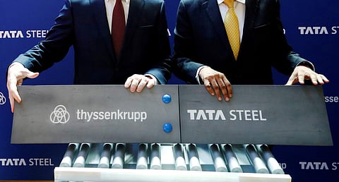 Germany's ThyssenKrupp CEO Heinrich Hiesinger and Chairman of Tata Steel Natarajan Chandrasekaran pose at a joint news conference after signing a final agreement on Saturday to establish a long-expected steel joint venture, in Brussels, Belgium July 2, 20