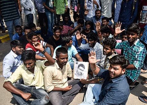 Nizam College students protest at the entrance gate of college demanding justice for the student Vijay who died on Wednesday night(Photo | EPS /Vinay Madapu)