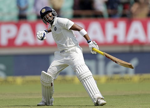 Indian cricketer Prithvi Shaw celebrates scoring a century during the first day of the first Test match between India and West Indies in Rajkot, India, Thursday, October 4, 2018. | AP