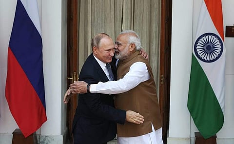PM Narendra Modi, right, hugs Russian President Vladimir Putin before their meeting in New Delhi. ( Photo | Shekhar Yadav/ EPS)