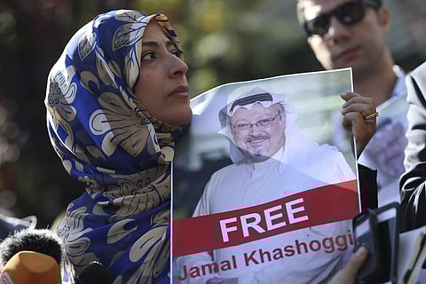 Holding a picture of missing Saudi writer Jamal Khashoggi, Tawakkol Karman, of Yemen the Nobel Peace Prize laureate for 2011, talks to members of the media near the Saudi Arabia consulate in Istanbul, Friday, Oct. 5, 2018. | Associated Press