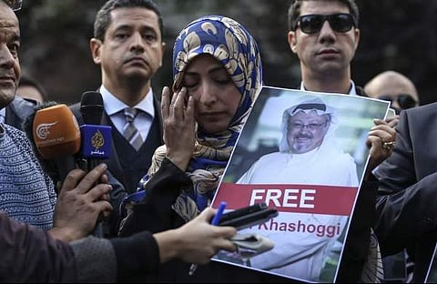Holding a picture of missing Saudi writer Jamal Khashoggi, Tawakkol Karman talks to members of the media near the Saudi Arabia consulate in Istanbul. (Photo | Associated Press)