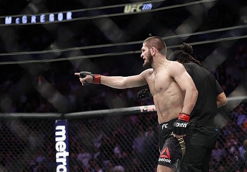 Khabib Nurmagomedov gestures after fighting Conor McGregor and winning the bout during a lightweight title mixed martial arts bout at UFC 229. (Photo | AP)