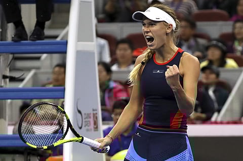 Caroline Wozniacki of Denmark reacts while competing against Anastasija Sevastova of Latvia in the women's singles final in the China Open at the National Tennis Center in Beijing. (Photo | AP)