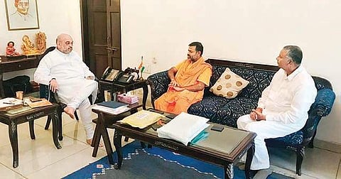 BJP chief Amit Shah, Paripoornananda and ex-MLA NVSS Prabhakar in Delhi on Monday| Express
