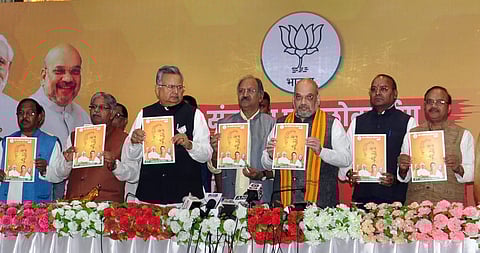 Bharatiya Janata Party (BJP) president Amit Shah and Chief Minister Raman Singh here released the party's manifesto, called 'Sankalp Patra'. | PTI