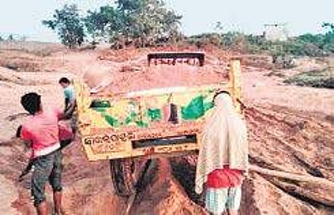 A tractor lifting sand near Badabaragaon | Express