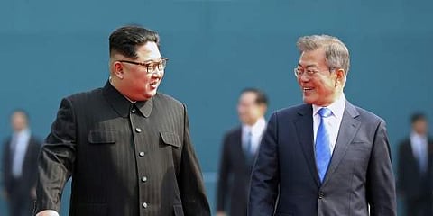 North Korean leader Kim Jong Un, left, in talks with South Korean President Moon Jae-in, right. (File | AP)