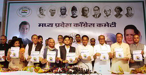 Congress State President Kamal Nath Congress leader and MP's Jyotiraditya Scindia Digvijay Singh Suresh Pachouri and other leaders attend the release of a manifesto for the upcoming Madhya Pradesh Assembly elections. (Photo|PTI)