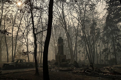 A chimney remains from a home burned in the Camp Fire, Saturday, Nov. 10, 2018, in Paradise, Calif. (Photo | AP)