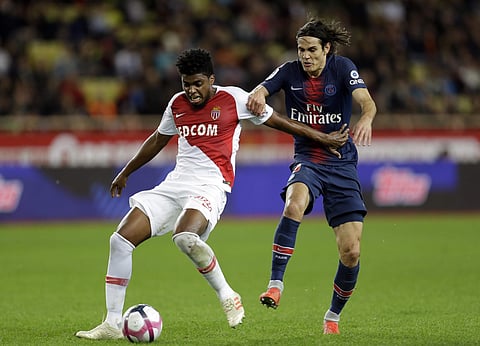 Monaco's Jesus Nascimento Jemerson, left, battles for the ball with PSG's Edinson Cavani during the French League One soccer match between AS Monaco and Paris Saint-Germain at Stade Louis II in Monaco. (Photo | AP)