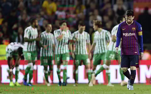 FC Barcelona's Lionel Messi, right, reacts after Betis scored during the Spanish La Liga soccer match between FC Barcelona and Betis at the Camp Nou stadium in Barcelona. (Photo | AP)