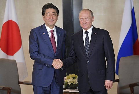Russian President Vladimir Putin, right, and Japanese Prime Minister Shinzo Abe pose for a photo during the ASEAN-Russia Summit in the ongoing 33rd ASEAN Summit (Photo | AP)