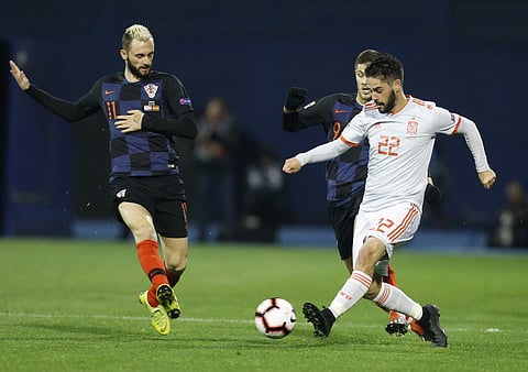 Spain's Isco (R) vies for the ball with Croatia's Andrej Kramaric (C) and Marko Rog (L) during the UEFA Nations League match | AP